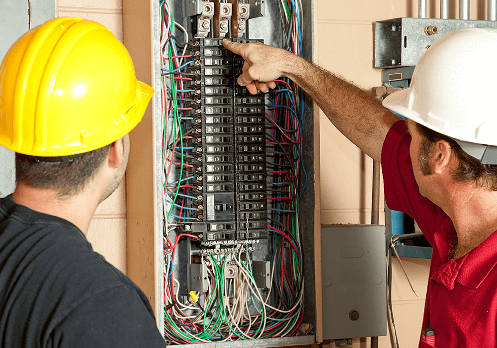 Electricians working on circuit breaker