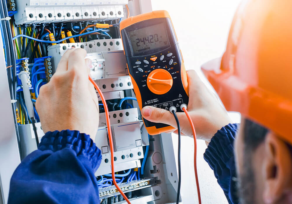 Electrician working with equipment